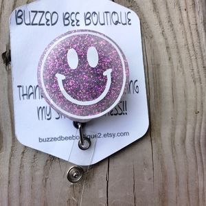 Lavender smiley face retractable name badge reel ID holder